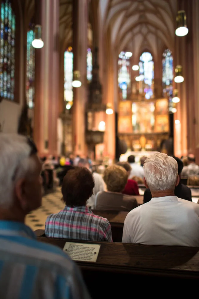 Interior of a place of worship with light through stained glass